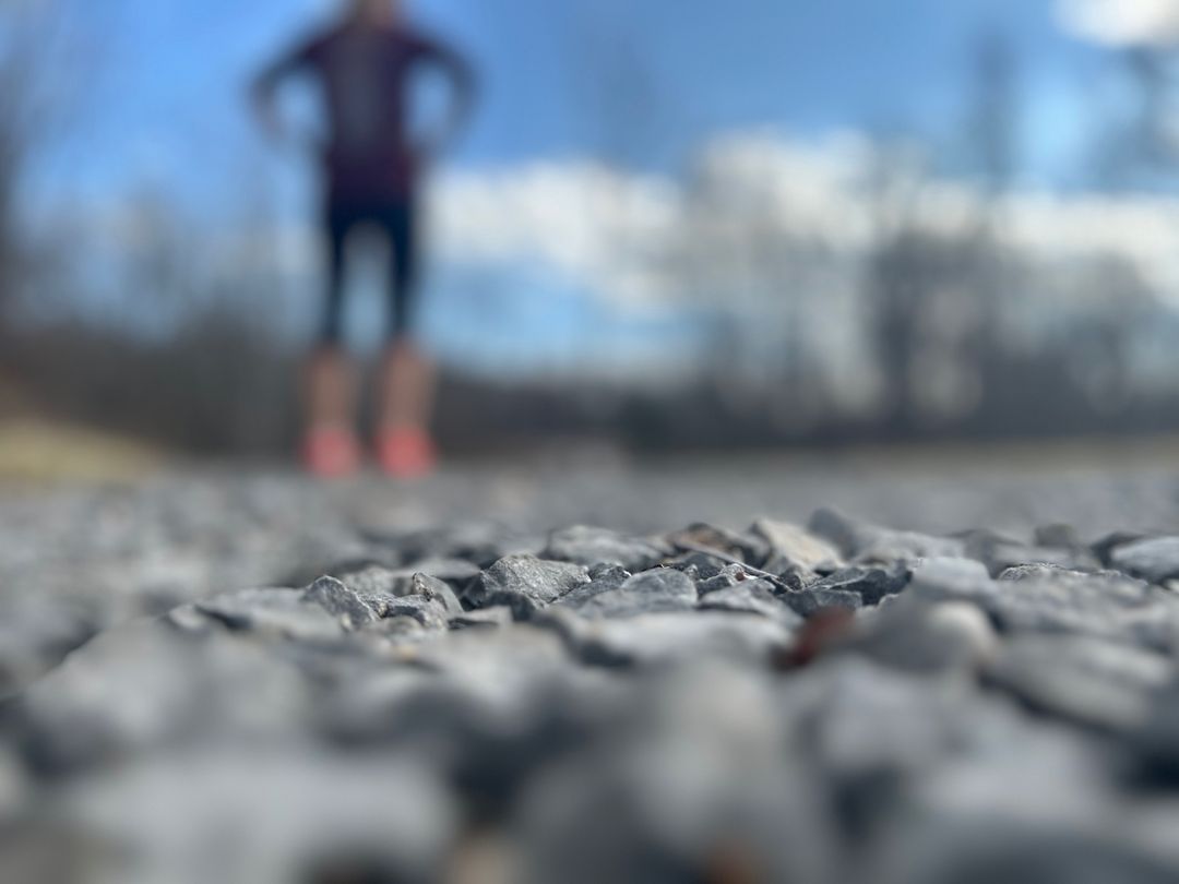 pebble path blurry person in distance