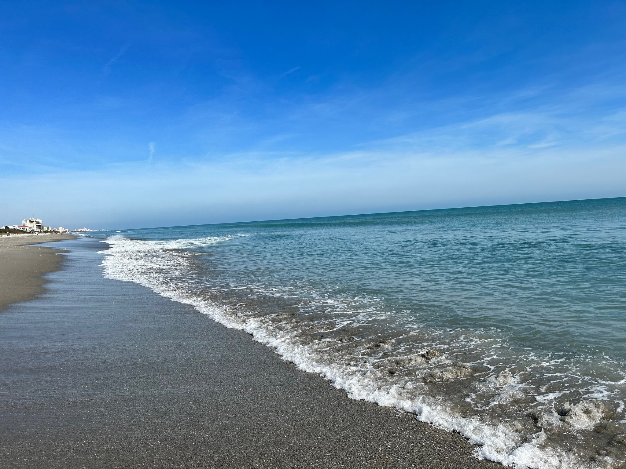 my feet on the edge of the ocean